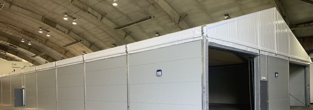 Building installed in aircraft hanger