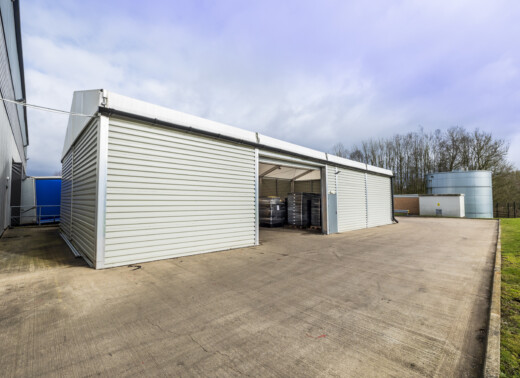temporary building with an electric roller shutter door and pedestrian access